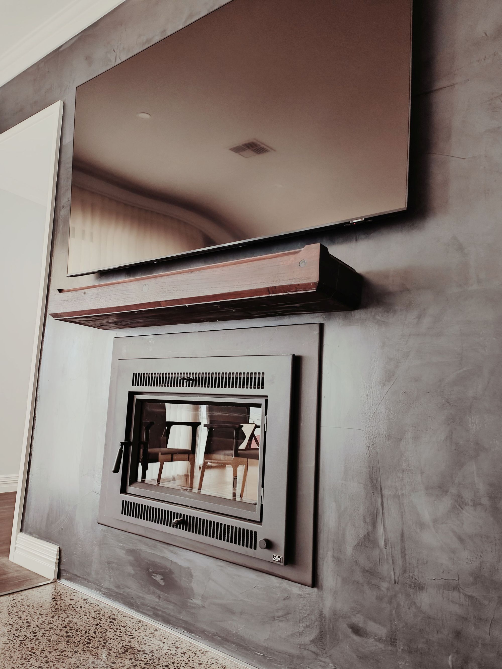 Element Structures — polished plaster feature wall with built-in fireplace